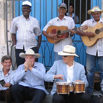 Two-visiting-yankis-sit-in-with-a-Havana-street-band.-The-author-plays-the-bongos-and-on-my-right-John-Parke-Wright-a-Florida-cattleman-riffs-on-the-harmonica.