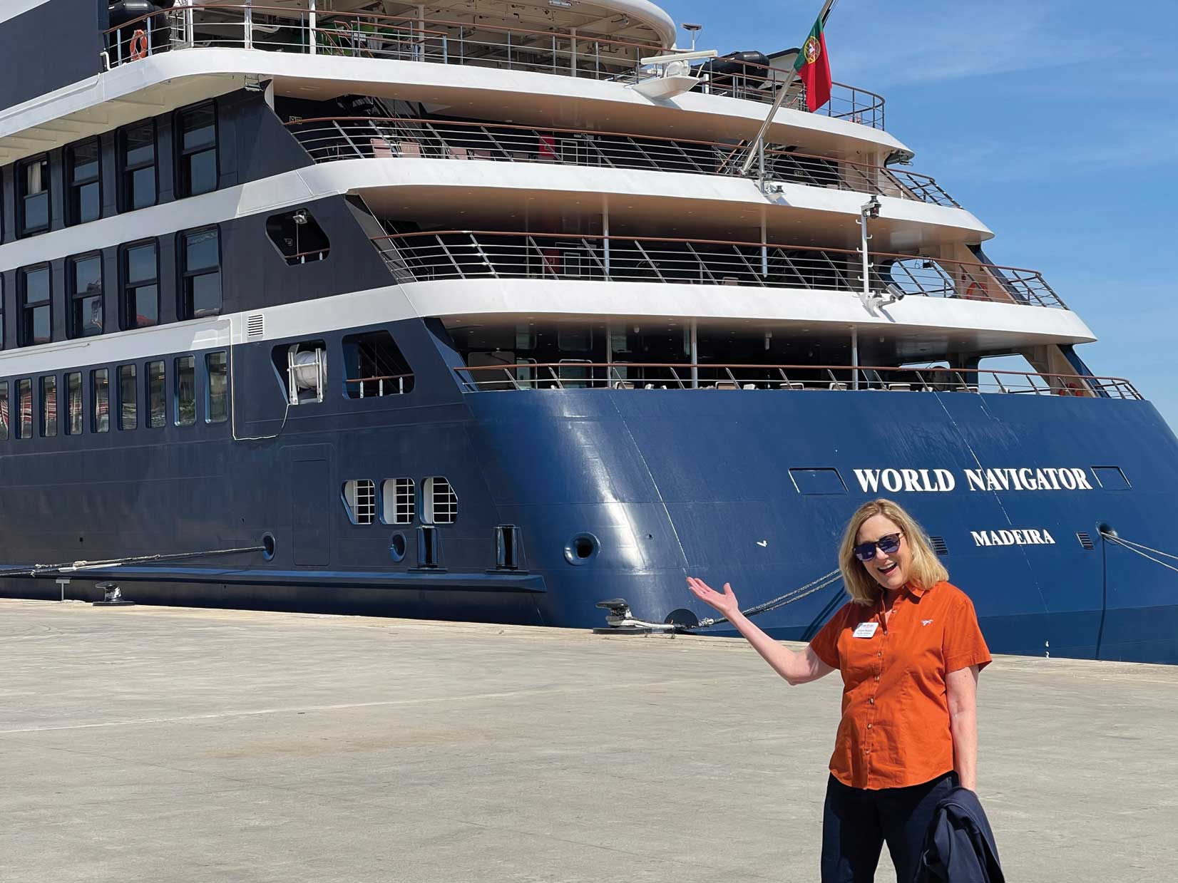 Diane Begala stands in front of the World Navigator cruise ship. 