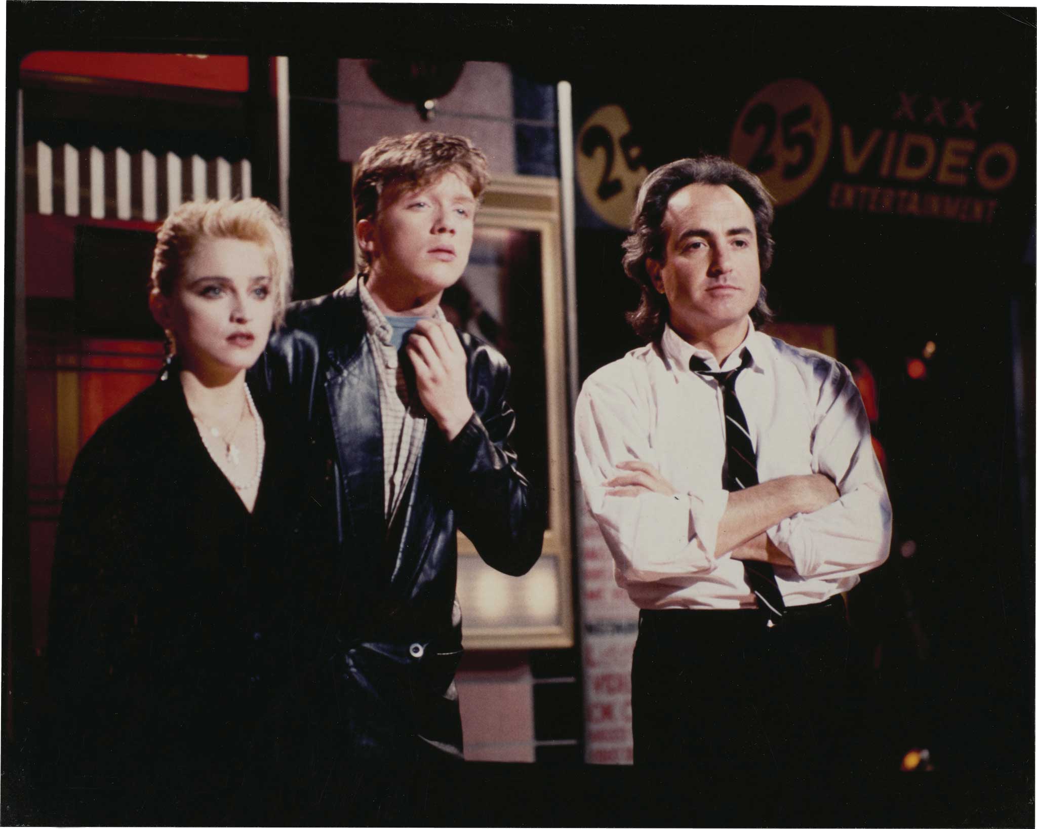 Lorne Michaels stands on stage with Madonna and Anthony Michael Hall