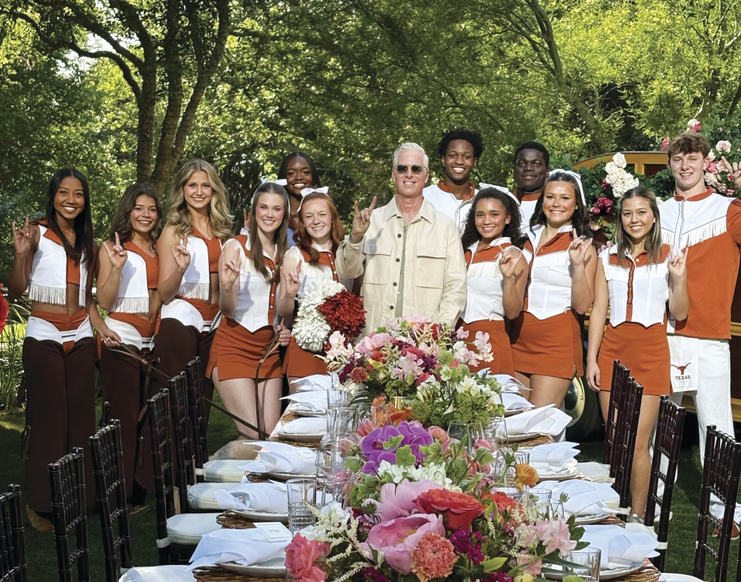 Jones poses with UT students. 