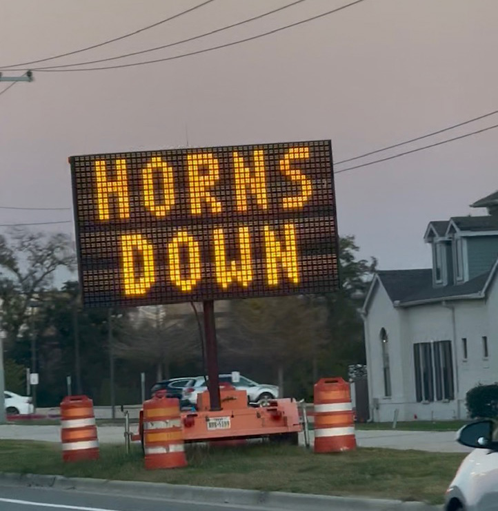 A road sign promoting the Texas AM Aggies.