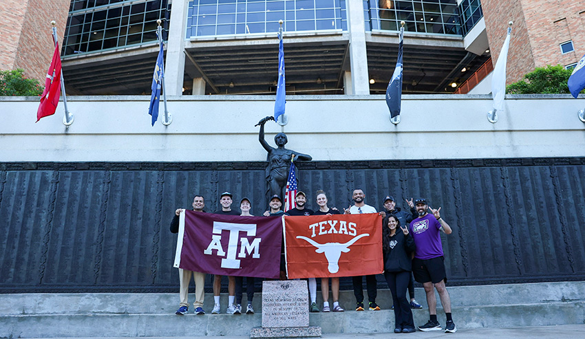 Participants of the Rivalry Relay fundraiser in front of Texas DKR Stadium
