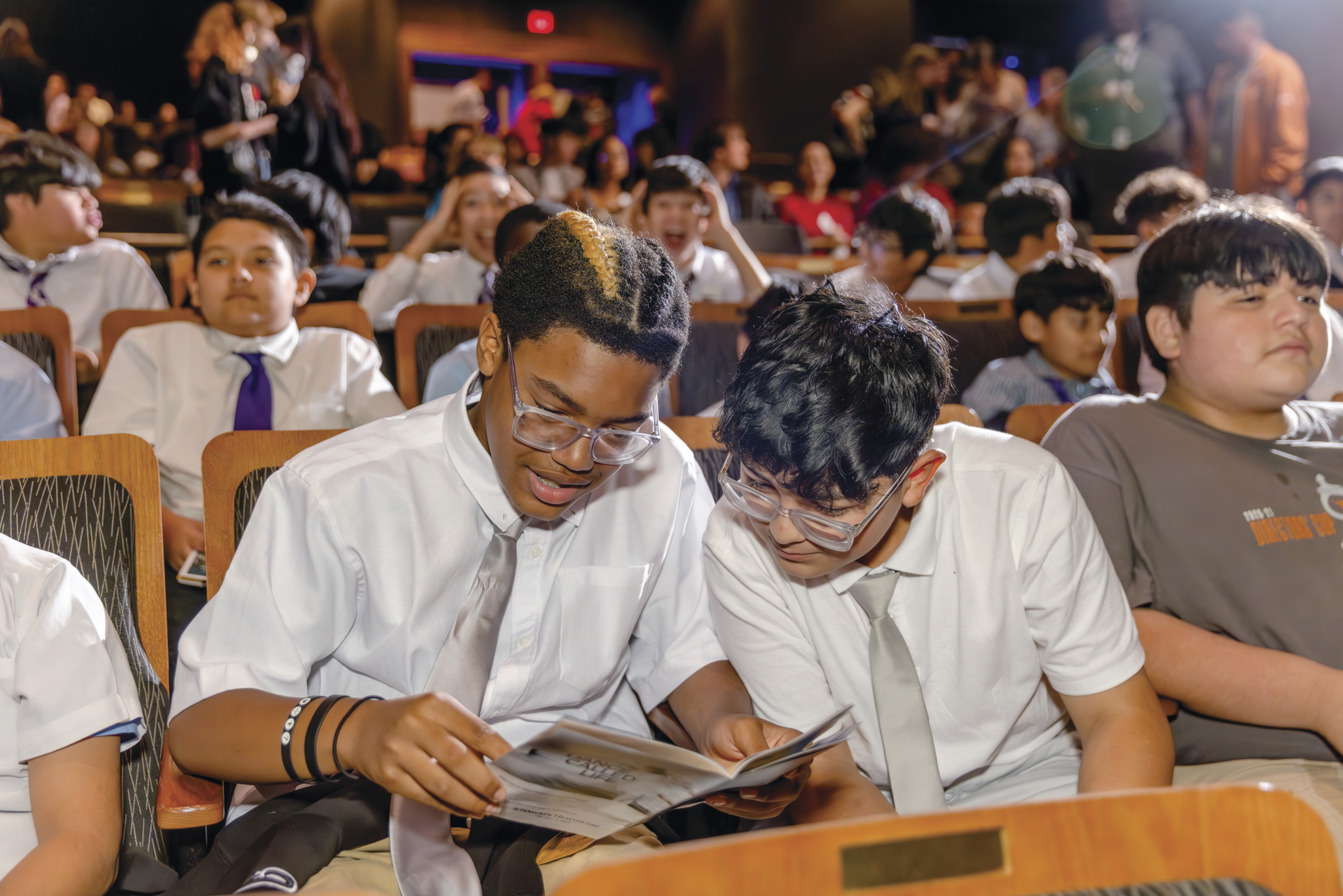 Students at a performance of "The Outsiders".