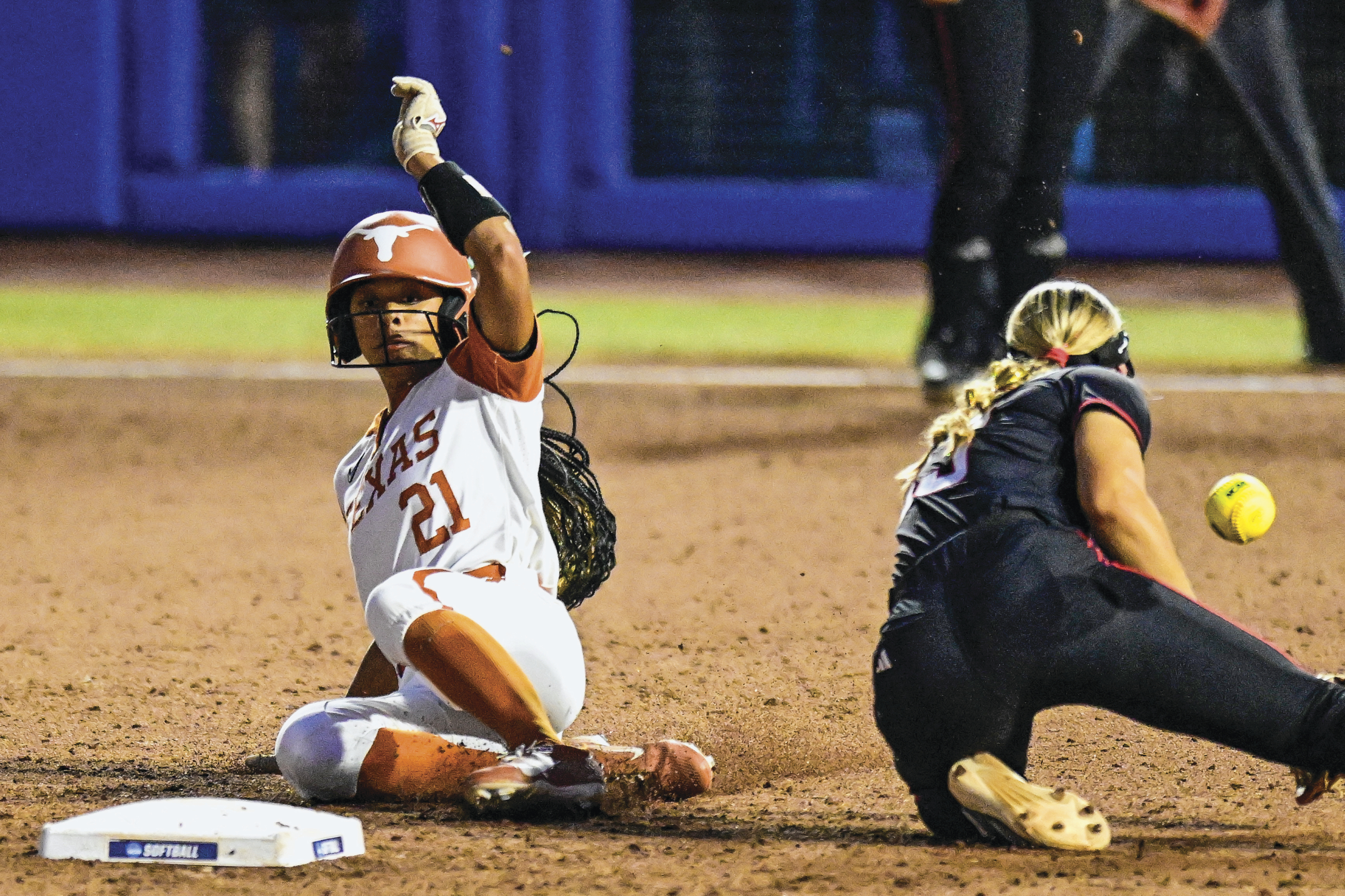 Kayden Henry slides to one of the bases.