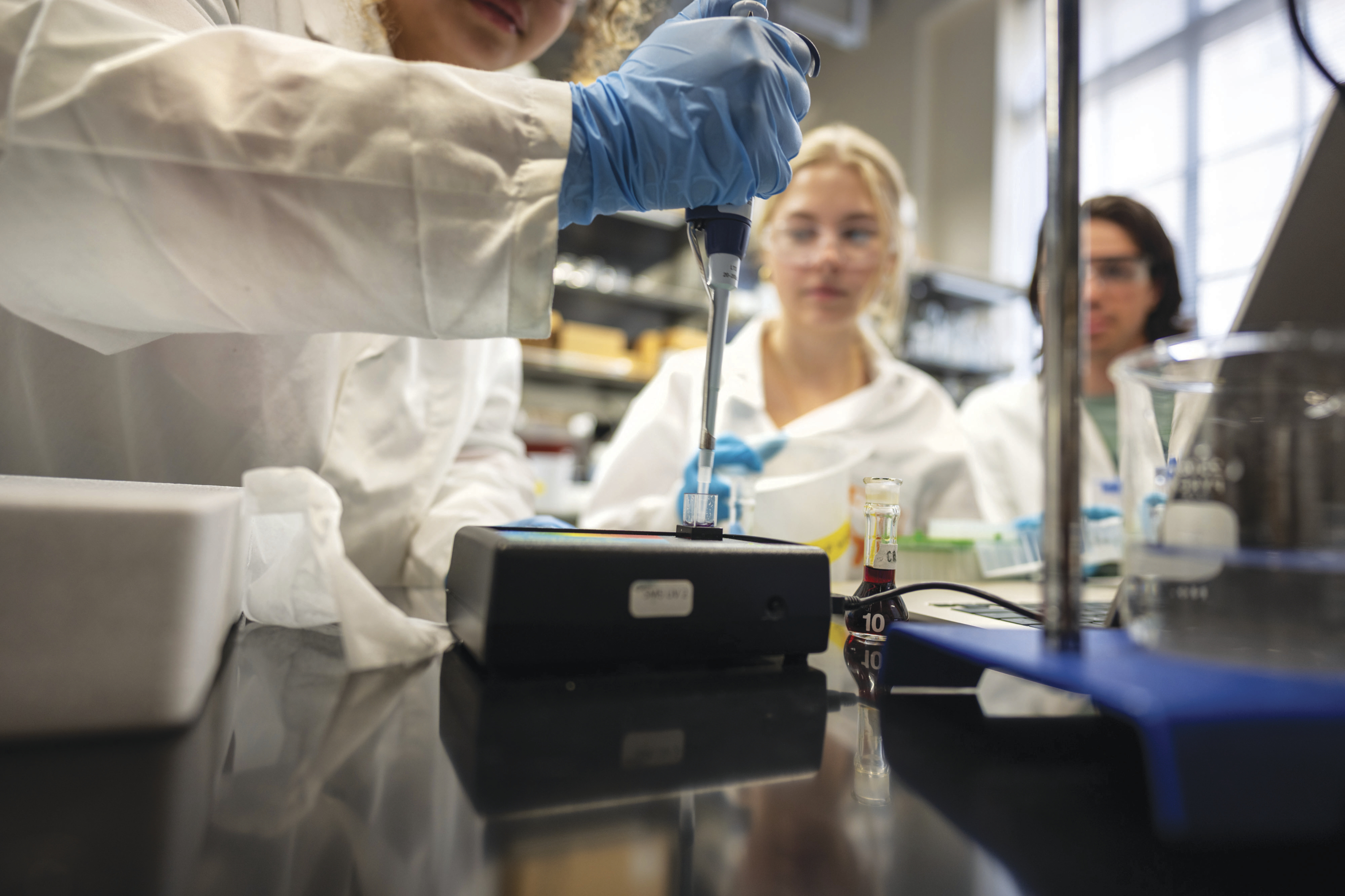 Wine samples being analyzed in a lab.
