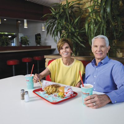 Patrick and Kathy Terry sit in their restaurant. 