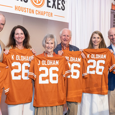Members of the Oldham family holds UT jerseys.