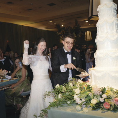 A bride and groom cuts the cake.