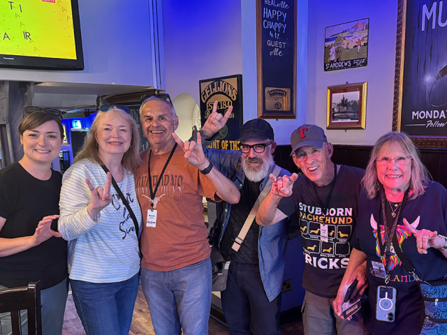 Group of Texas Longhorns in Scotland at a pub.