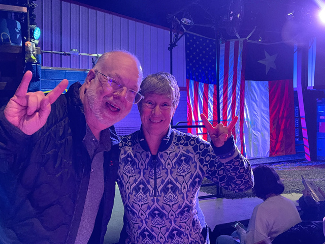 Two fans give a Hook Em Horns at an Off Broadway production. 