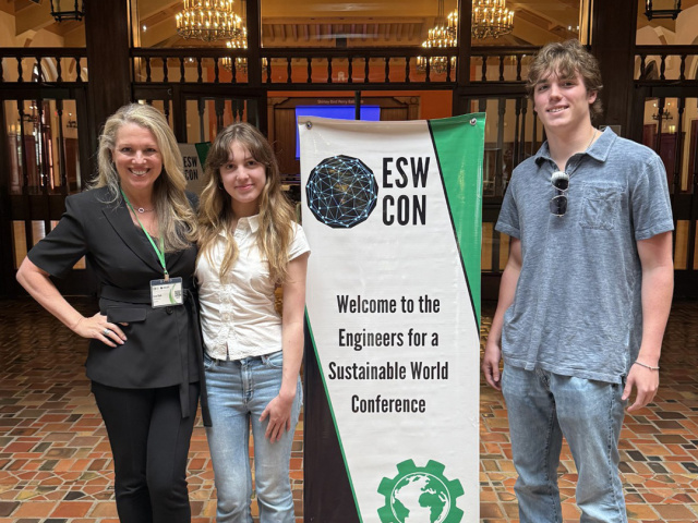 Three people posing at the Texas Student Union
