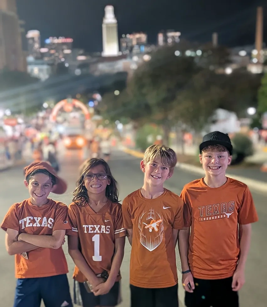 Four young Longhorns fans attend their first UT football game.