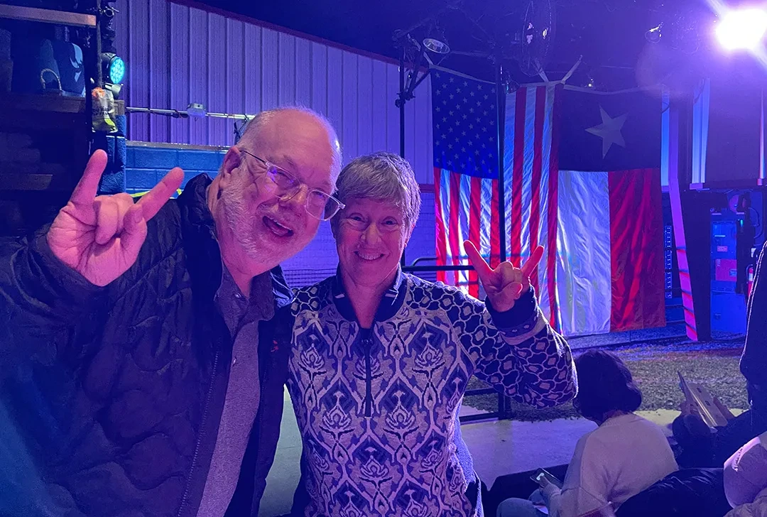 Two fans give a Hook Em Horns at an Off Broadway production. 