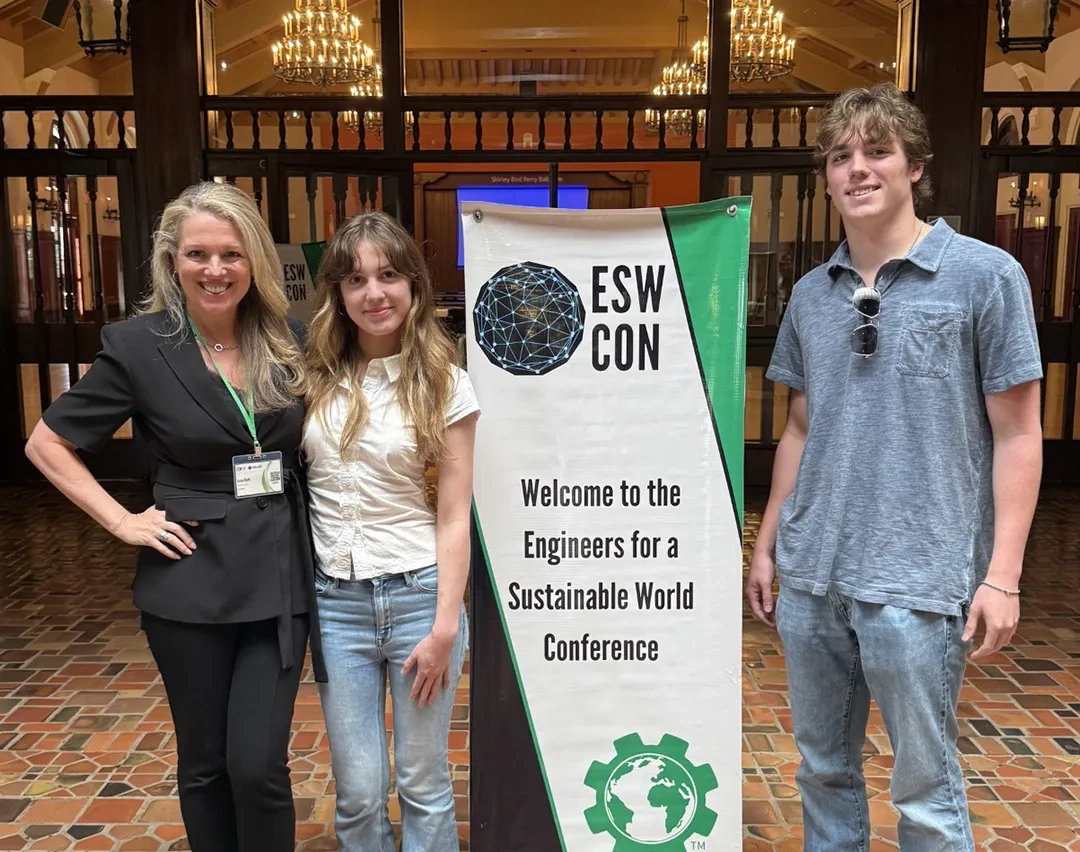 Three people posing at the Texas Student Union