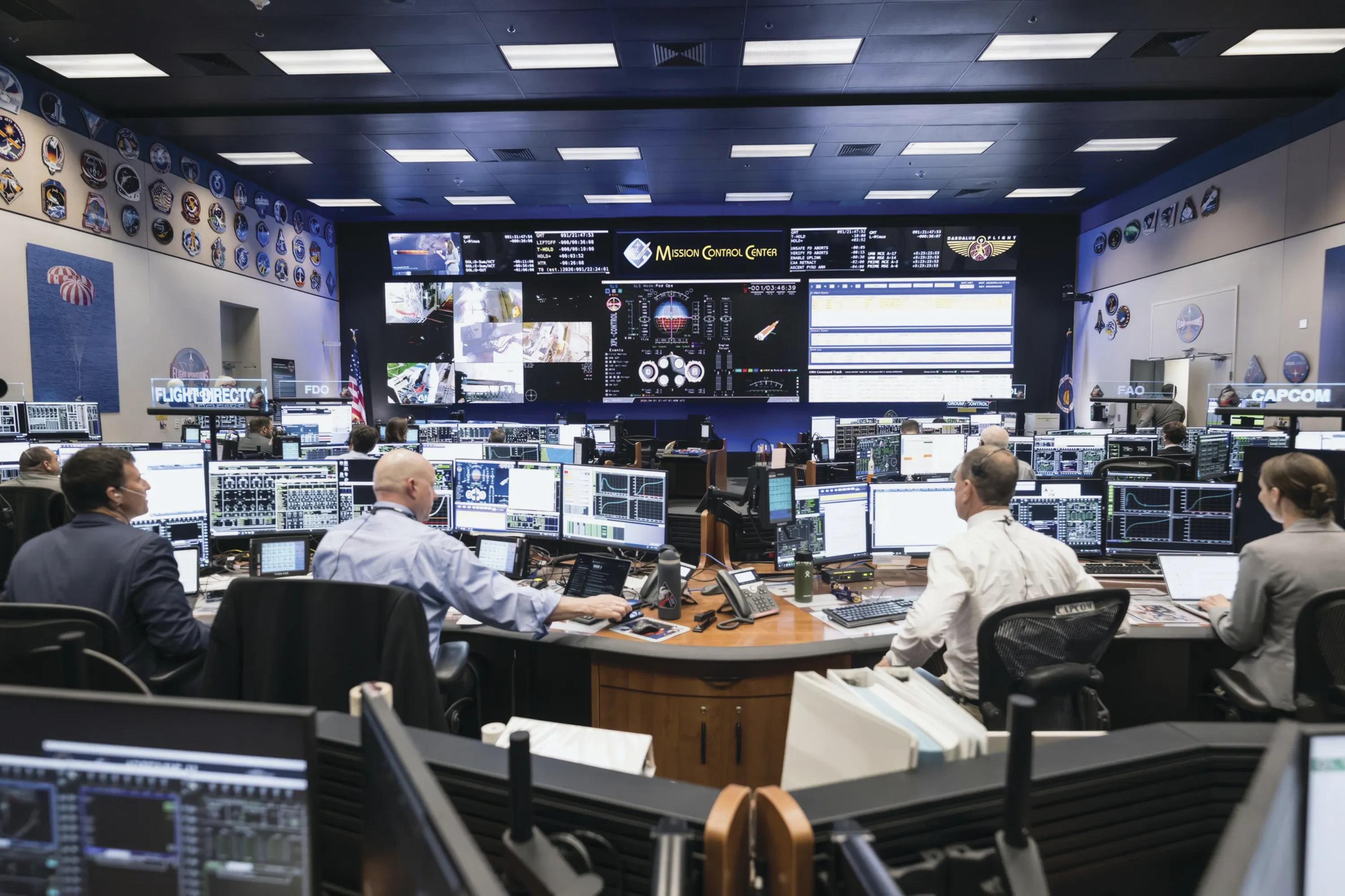 A wide shot of Mission Control at Johnson Space Center.