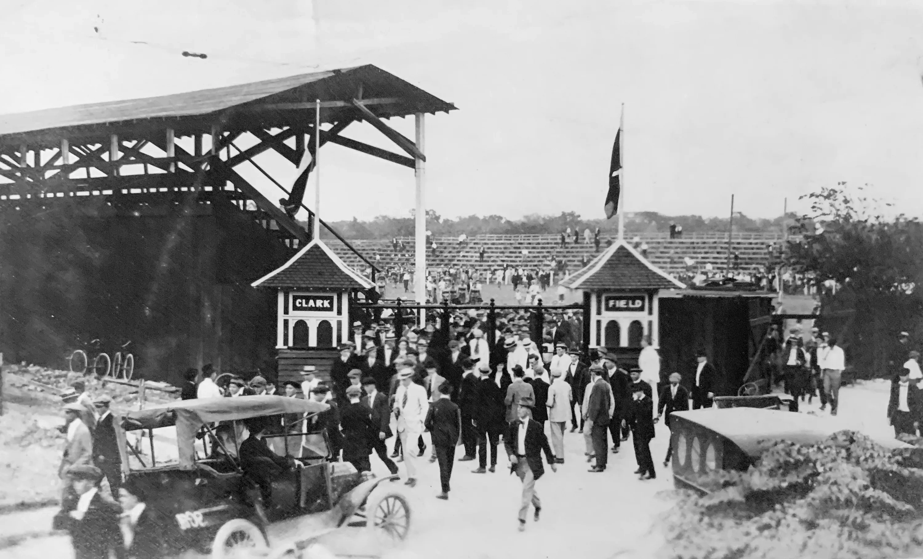 An archival photo of a crowd walking into a football game at Clark Field, 1914.
