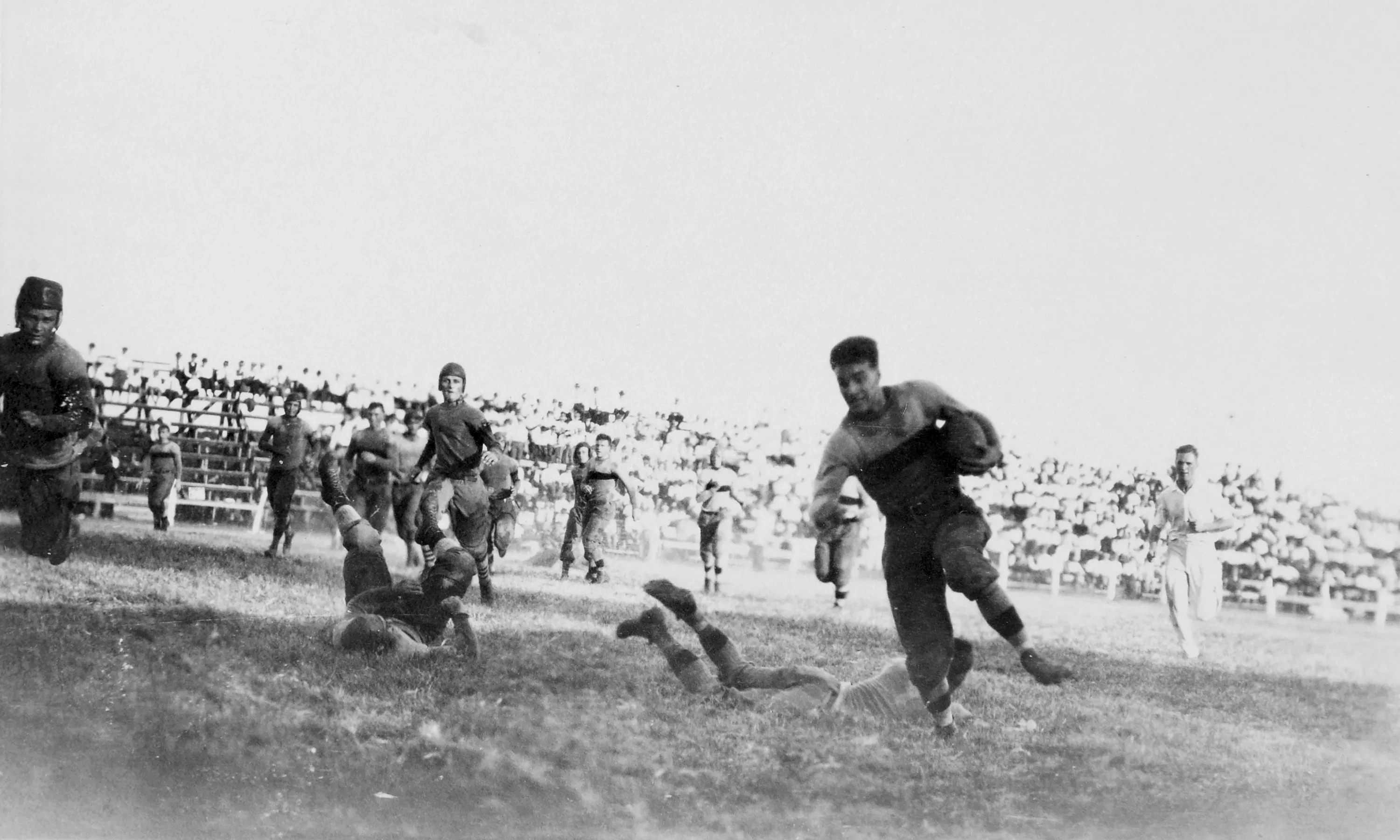 An archival photo of a football play, 1914.