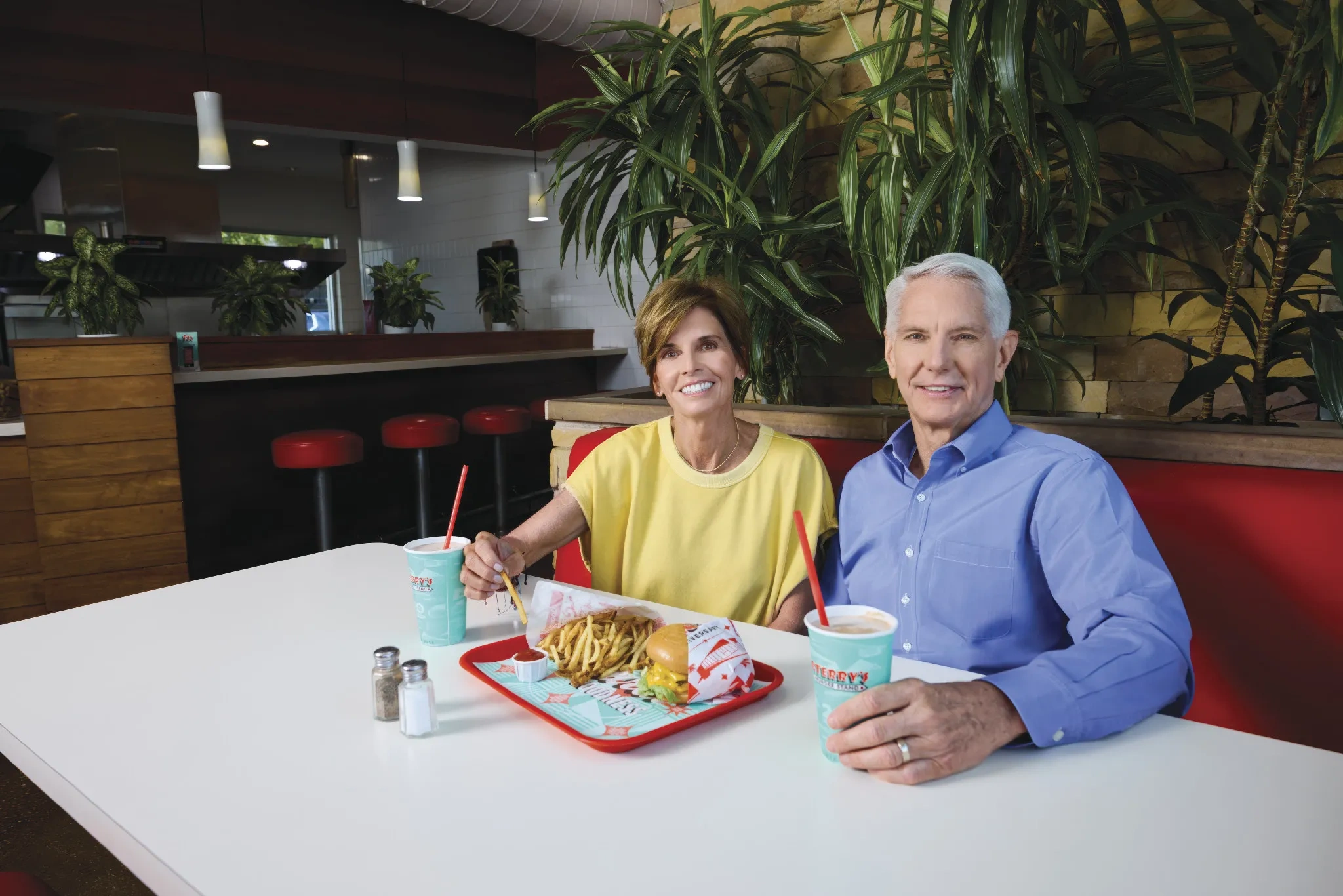 Patrick and Kathy Terry sit in their restaurant. 