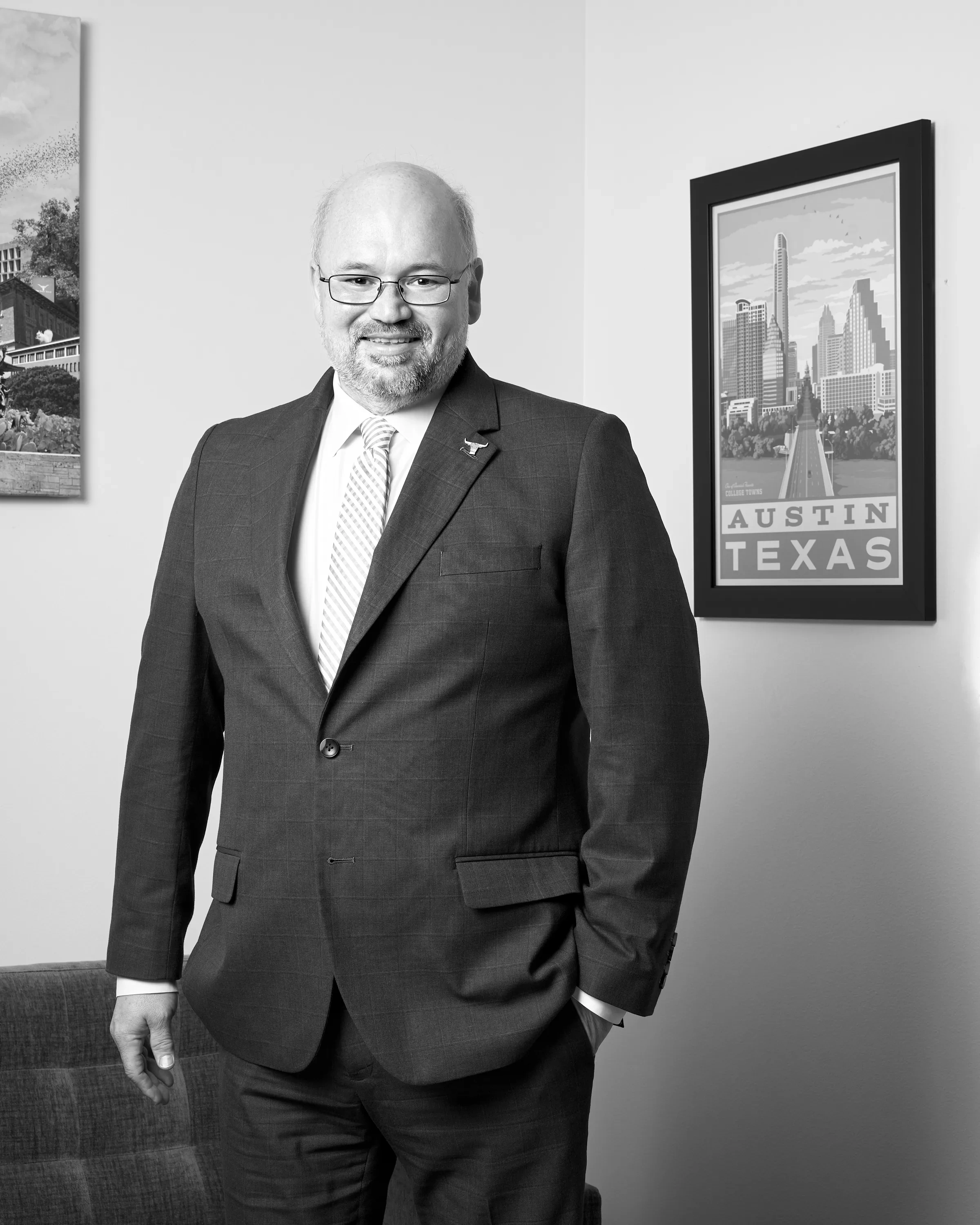 A man stands in a suit.