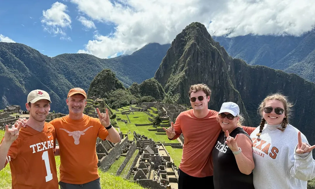 Family of UT alumni atop Machu Picchu.
