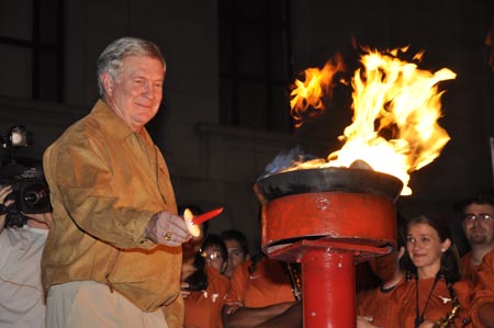Head coach Mack Brown lights the first red candle