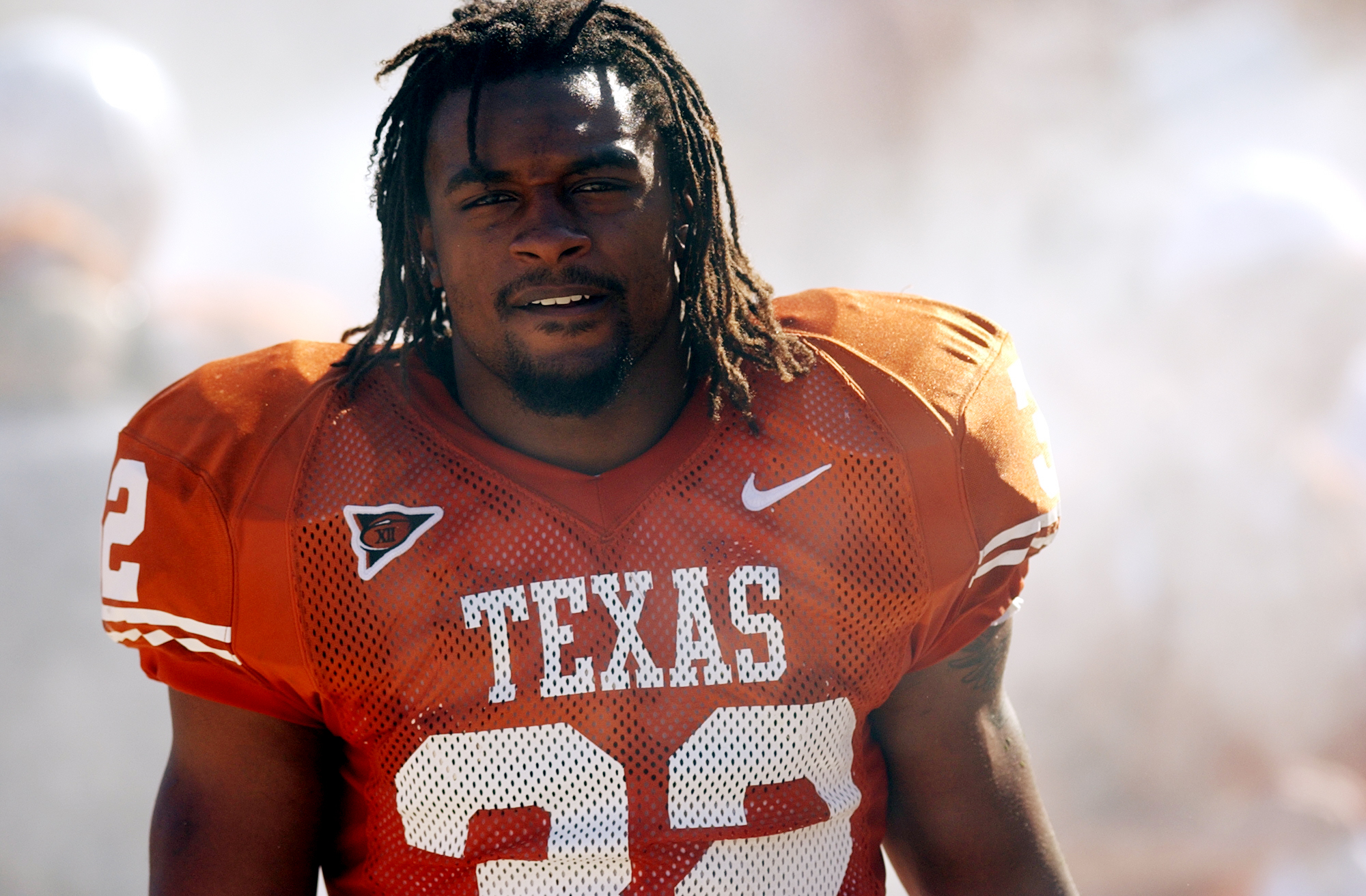 Texas honors late Cedric Benson with No. 32 sticker on football helmets